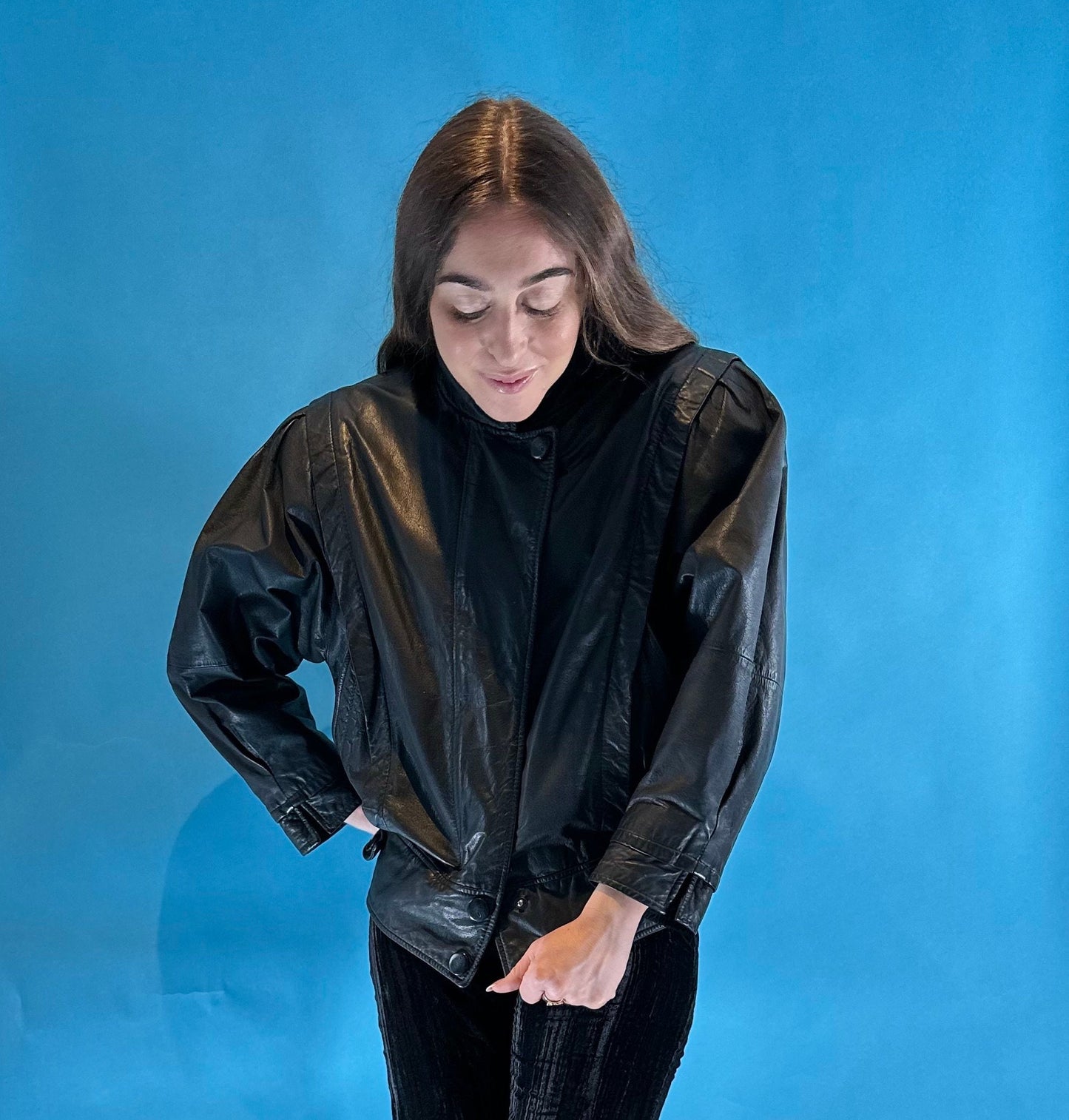 Vintage 1980s Black Leather Biker Jacket with Dolman Sleeves and Pop Button Up Details.