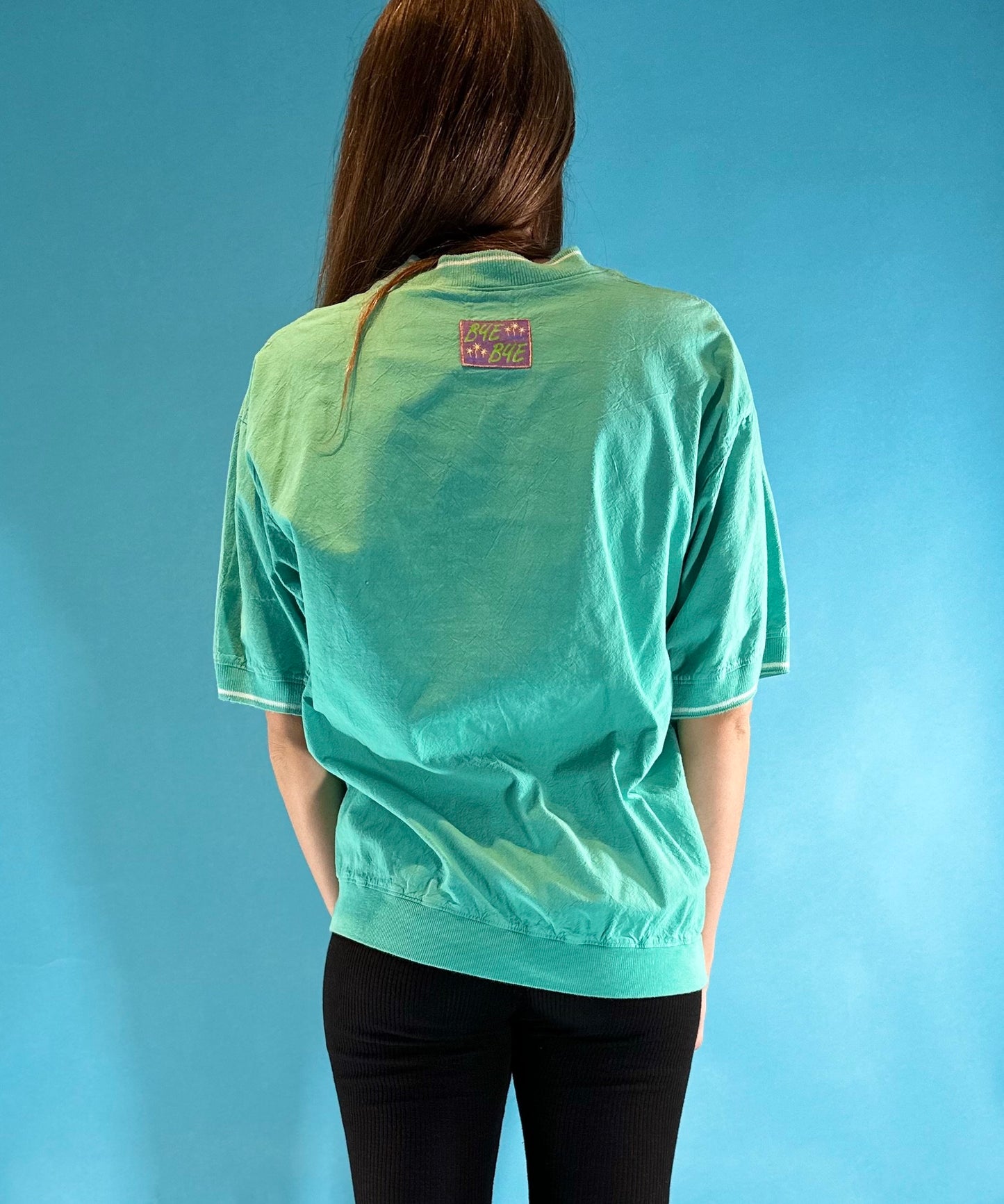 Vintage 1990s TuneSqaud Logo Mockneck Cuffed T-Shirt.