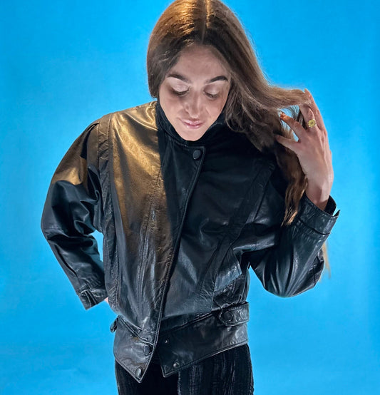 Vintage 1980s Black Leather Biker Jacket with Dolman Sleeves and Pop Button Up Details.