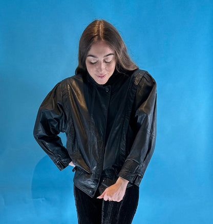 Vintage 1980s Black Leather Biker Jacket with Dolman Sleeves and Pop Button Up Details.