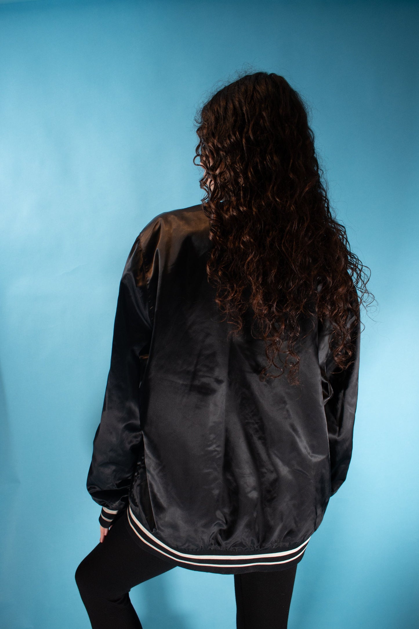 Vintage 1990s Size XL Nike SW Satin Bomber Jacket in Black.